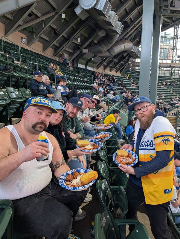 Mitch Kreps and his friends pose in the terrace section of American Family Field on April 28, 2026.