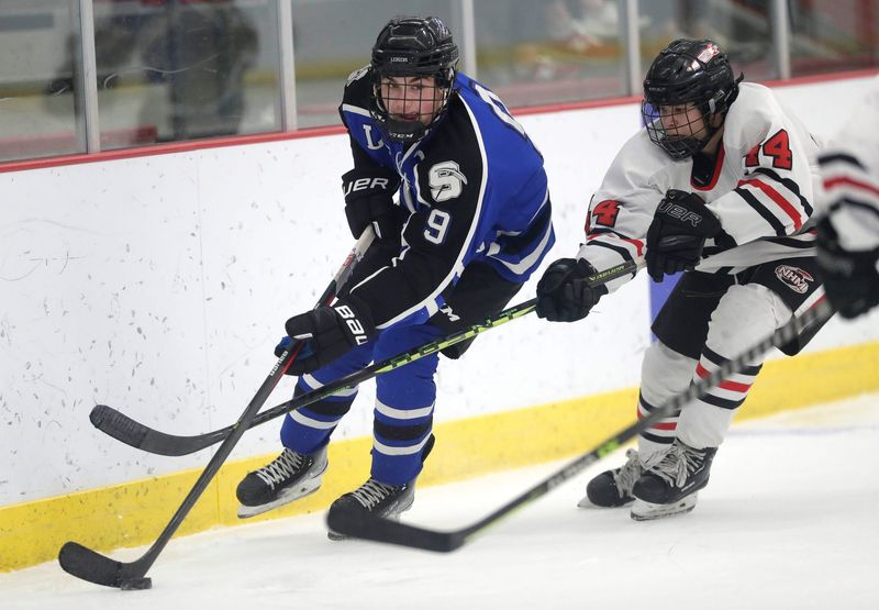 St. Mary's Springs Academy's Talan Blanck (9) gets past Neenah/Hortonville/Menasha High School's Ty Laabs (44) during their boys hockey game Tuesday, January 3, 2023, at the Community First Champion Center in Grand Chute, Wis. Dan Powers/USA TODAY NETWORK-Wisconsin

Apc Neenahvsstmaryspringbh 0103232267djp
