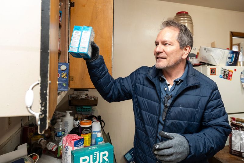 Sam Stair, the owner of S2 Real Estate, cleans up a unit after a tenant’s abrupt departure on April 1, 2026, in Milwaukee, Wisconsin. “It was like a drug issue. They got raided by the police,” said Stair.