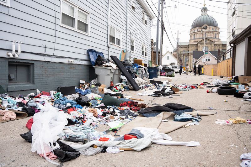 Piles of discarded trash litter an alley adjacent to an S2 Real Estate property on South Chase Avenue on April 1, 2026, in Milwaukee, Wisconsin. Sam Stair, the owner of S2 Real Estate, says he gets ticketed if he doesn’t clean up the illegal dumping.