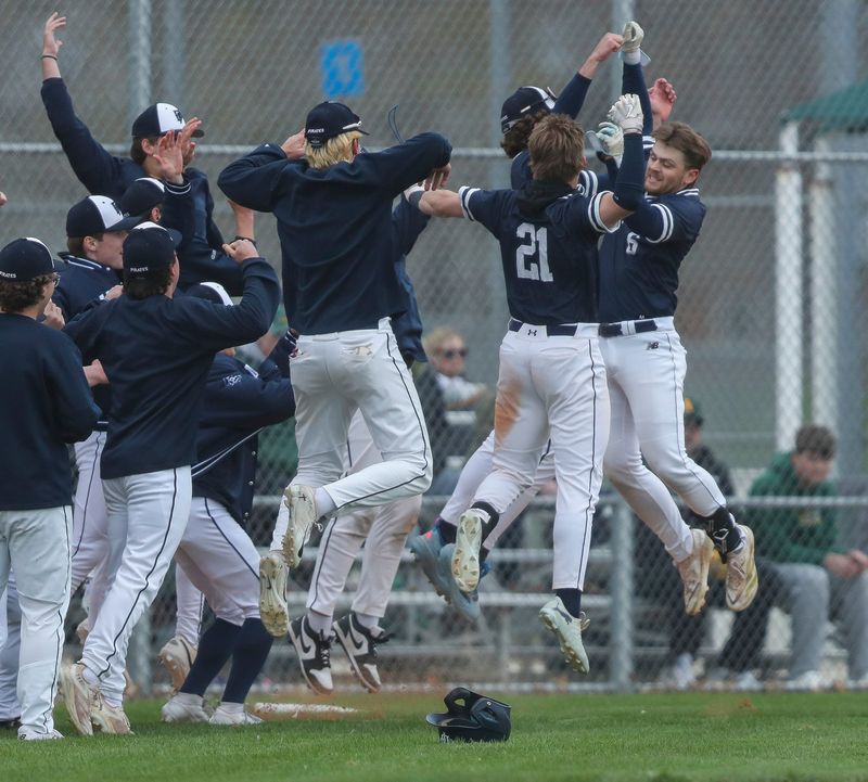 Bay Port High School's Carson Hawley (6) celebrates with his teammates after hitting a go-ahead 3-run home run against Ashwaubenon High School on Thursday, April 30, 2026, at Ashwaubomay Lake Park in Ashwaubenon, Wis. Bay Port won the game, 8-4.
Tork Mason/USA TODAY NETWORK-Wisconsin