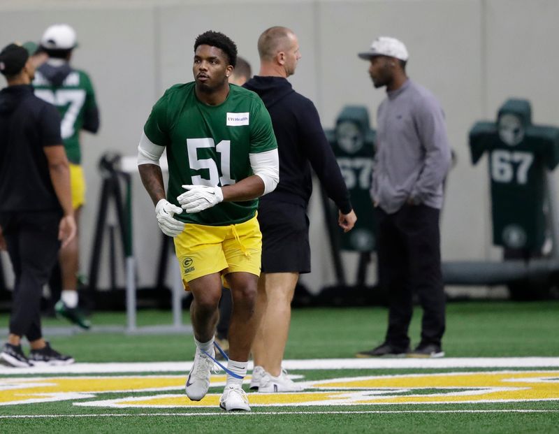 Green Bay Packers pass rusher Dani Dennis-Sutton warms up during rookie minicamp.