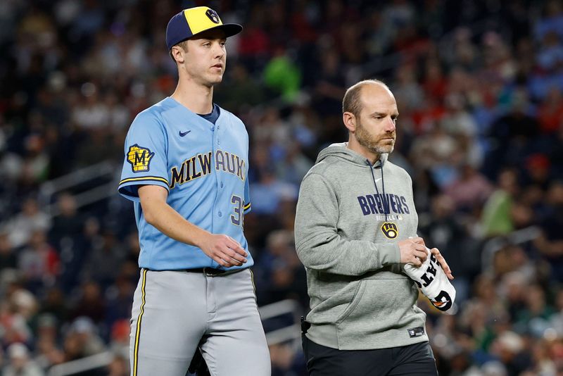May 1, 2026; Washington, District of Columbia, USA; Milwaukee Brewers pitcher Jacob Misiorowski (32) leaves the field alongside Brewers heard trainer Brad Epstein (R) after an injury against the Washington Nationals during the sixth inning at Nationals Park. Mandatory Credit: Geoff Burke-Imagn Images
