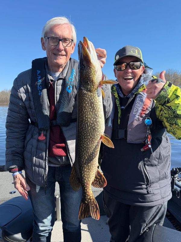 Governor Tony Evers holds a 32-inch-long northern pike he caught May 2, 2026 while fishing with Capt. Barb Carey on Nelson Lake near Hayward. Gov. The fishing was part of the 60th anniversary of the Wisconsin Governor's Fishing Opener.