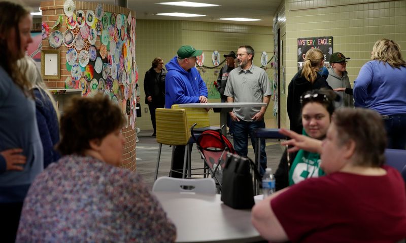 Current and former students, teachers and staff of MacArthur Elementary School tour the building during an open house on May 3, in Green Bay. The school is one of four in the Green Bay Area Public School District that closed at the end of the academic year.