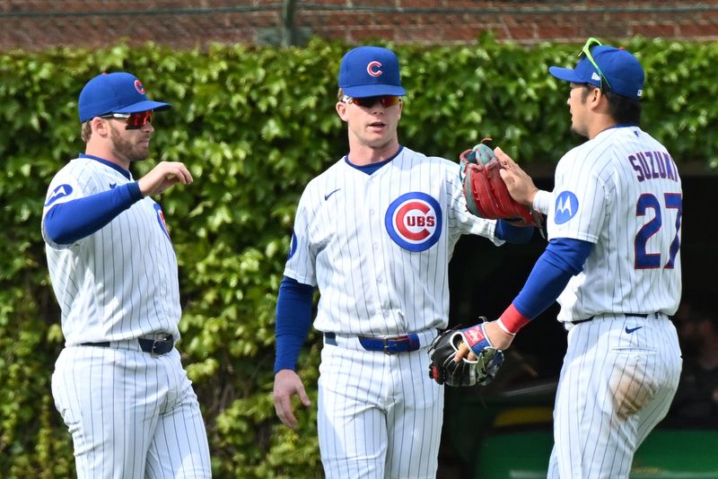 May 3, 2026; Chicago, Illinois, USA; Chicago Cubs left fielder Ian Happ (8), center fielder Pete Crow-Armstrong (4) and right fielder Seiya Suzuki (27) celebrate their victory over the Arizona Diamondbacks at Wrigley Field. Mandatory Credit: Patrick Gorski-Imagn Images