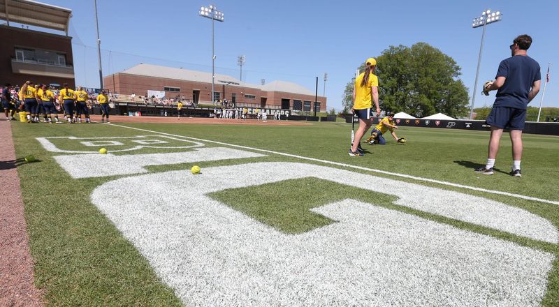 The Michigan Wolverines warmup Saturday, May 10, 2025, ahead of the Big Ten softball tournament championship game against the UCLA Bruins at Purdue Universityâ€™s Bittinger Stadium in West Lafayette, Indiana.