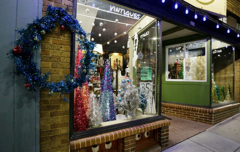 Gritty Lane has several small aluminum Christmas trees in its windows as seen, Tuesday, December 21, 2021, in Manitowoc, Wis..