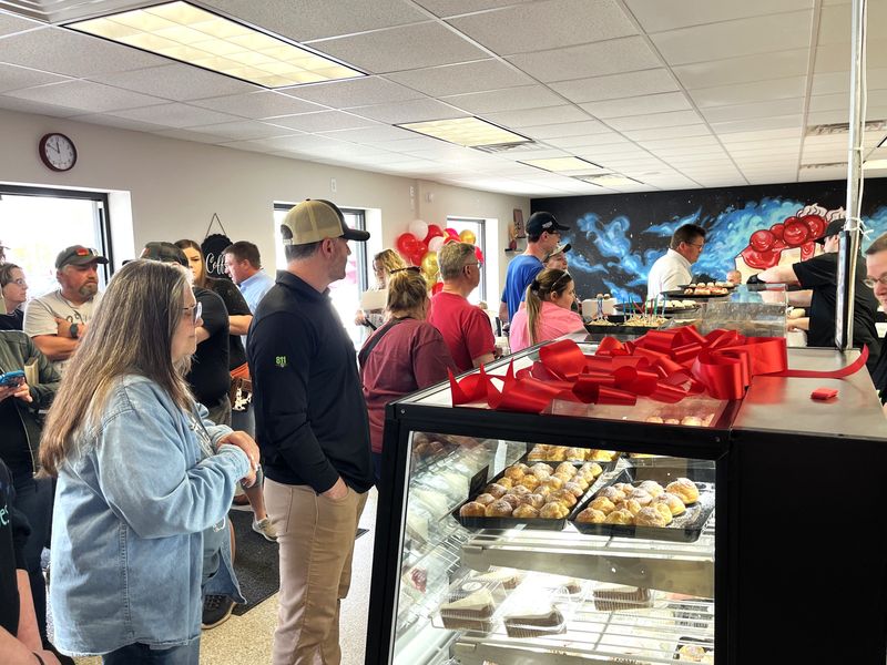 Guests who attended the ribbon cutting were the first in line when The Cheesecake Slice opened May 4, 2026 at 3940 Eighth St. S. in Wisconsin Rapids.