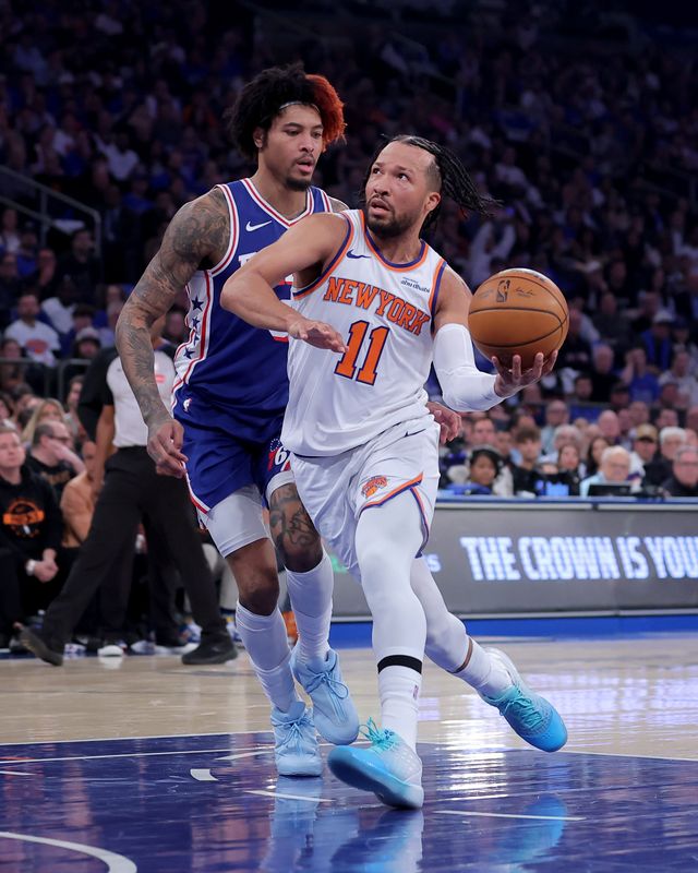 New York Knicks guard Jalen Brunson (11) drives to the basket against Philadelphia 76ers forward Kelly Oubre Jr. (9) during Game 1 of their second-round playoff series on May 4, 2026.