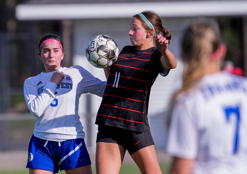 Pulaski High School's Maggie Gumina (11) gains control of the ball against Green Bay Southwest High School's Andie Troup (5) on Tuesday, May 5, 2026, at Pulaski Middle School in Pulaski, Wis. Pulaski won the match, 8-0.
Tork Mason/USA TODAY NETWORK-Wisconsin