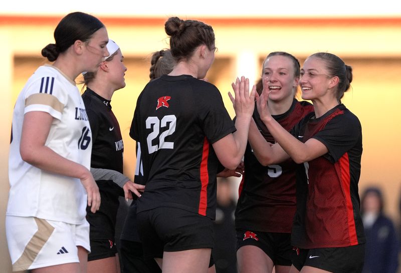 Kimberly High School's Ashlyn Krueger (22) celebrates scoring a goal with teammates during their girls soccer game against Appleton North High School Tuesday, May 5, 2026, in Kimberly, Wisconsin. Kimberly won 3-2.