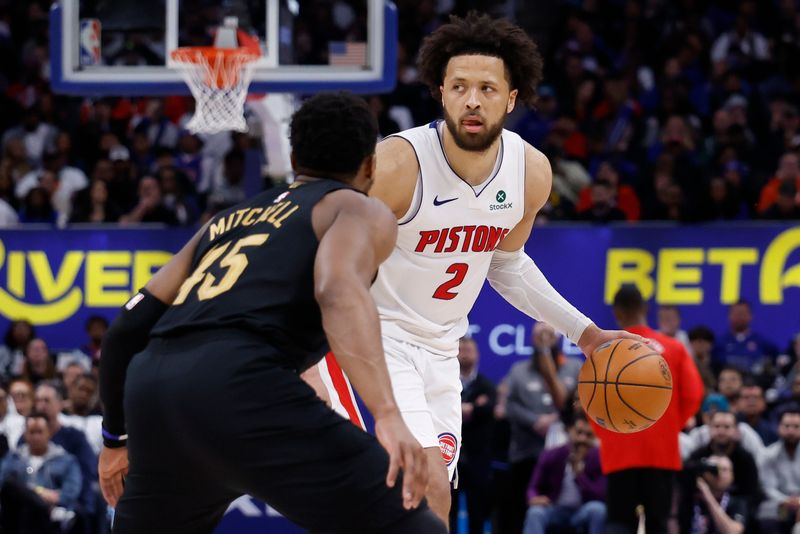 May 5, 2026; Detroit, Michigan, USA; Detroit Pistons guard Cade Cunningham (2) dribbles defended by Cleveland Cavaliers guard Donovan Mitchell (45) in the second half during game one of the second round of the 2026 NBA Playoffs at Little Caesars Arena. Mandatory Credit: Rick Osentoski-Imagn Images