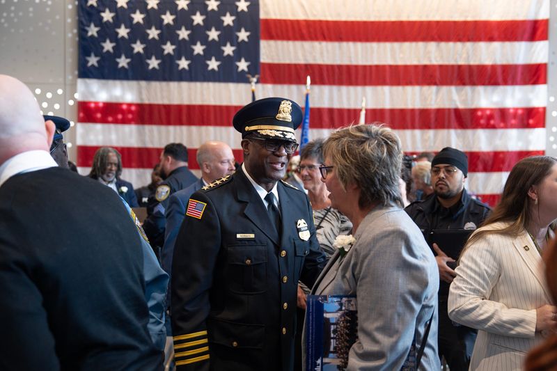 Milwaukee Police Chief Jeffrey Norman speaks with a guest of the 2026 Greater Milwaukee Law Enforcement Memorial Ceremony at the Milwaukee County War Memorial Center on May 6 in Milwaukee.