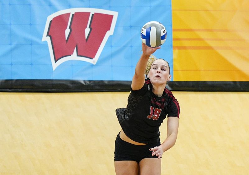 Dec 18, 2025; Kansas City, MO, USA; Wisconsin Badgers outside hitter Mimi Colyer (15) serves during the second set against the Kentucky Wildcats in a 2025 NCAA Womenâ€™s Volleyball Championship semifinal match at T-Mobile Center. Mandatory Credit: Jay Biggerstaff-Imagn Images