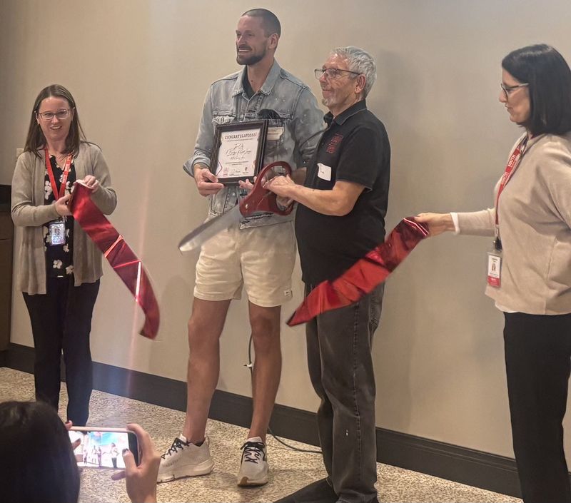 Tyler Colby (center left) won free rent for a year in a downtown South Milwaukee storefront as part of the "Space Race" contest. Colby, pictured with former South Milwaukee Mayor Jim Shelenske, plans to create 7 Bridges Record Lounge at 1003 Milwaukee Ave.