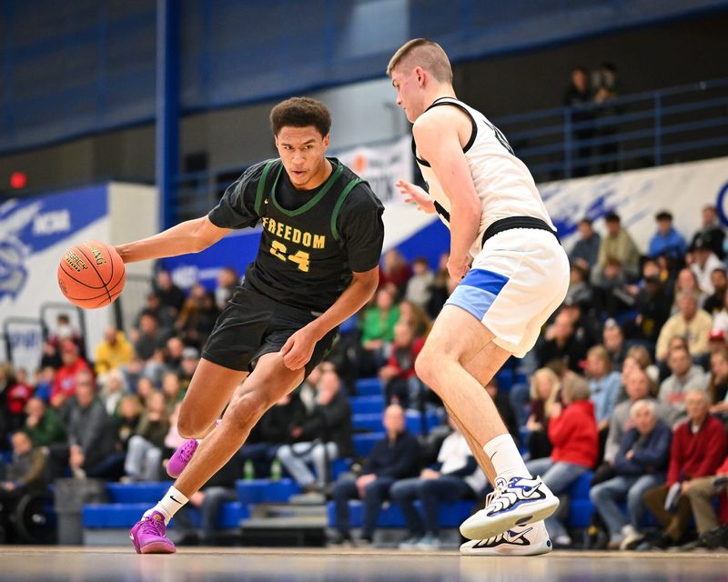 Freedom forward Donovan Davis (24) drives to the basket against the defense of Brookfield Central forward Henry Gruetzmacher (31) in the Rick Majerus WBY Shootout on Saturday, December 27, 2025, at Concordia University in Mequon, Wisconsin. Freedom won, 74-58.
