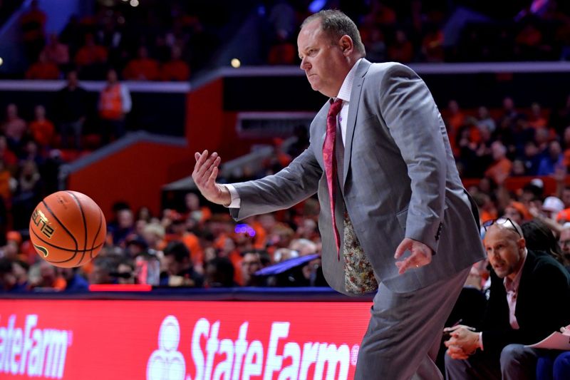 Dec 10, 2024; Champaign, Illinois, USA; Wisconsin Badgers head coach Greg Gard throws the ball to a referee during the second half against the Illinois Fighting Illini at State Farm Center. Mandatory Credit: Ron Johnson-Imagn Images