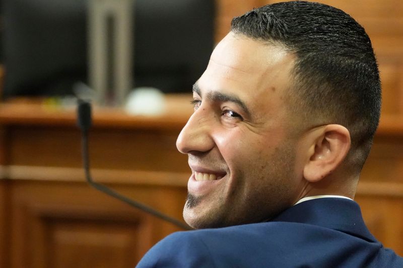 Abdallah Ismail, Milwaukee food truck owner, is all smiles while looking back in the gallery where other food truck owners were seated, on Friday, May 8, 2026 in Milwaukee County Courthouse, Milwaukee, Wisconsin. Judge Jean Kies issued on a temporary restraining order against the ordinance that would have forced Ismail and other food trucks to close early at 10 p.m. A conservative legal group was suing Milwaukee over food truck curfew in the first hearing today.