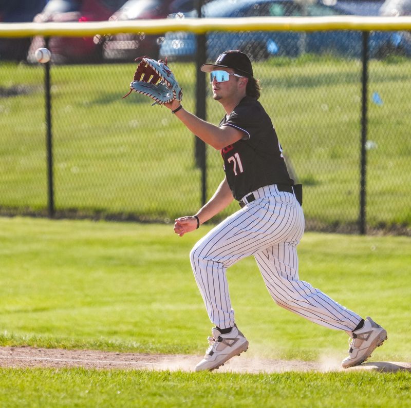 Muskego's Carter Nicolato (27) makes the play at first base during the game at Mukwonago High School on Thursday, May 7, 2026, in Mukwonago, Wisconsin. Muskego won the game, 16-0.