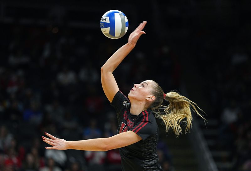 Dec 18, 2025; Kansas City, MO, USA; Wisconsin Badgers outside hitter Mimi Colyer (15) warms up before a 2025 NCAA Womenâ€™s Volleyball Championship semifinal match against the Kentucky Wildcats at T-Mobile Center. Mandatory Credit: Jay Biggerstaff-Imagn Images