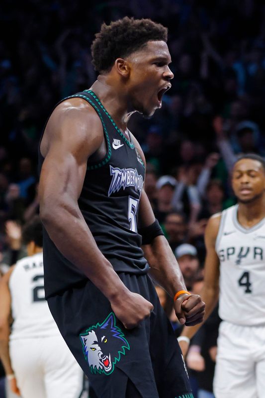 May 10, 2026; Minneapolis, Minnesota, USA; Minnesota Timberwolves guard Anthony Edwards (5) celebrates his basket against the San Antonio Spurs late in the fourth quarter of game four of the second round of the 2026 NBA Playoffs at Target Center. Mandatory Credit: Bruce Kluckhohn-Imagn Images