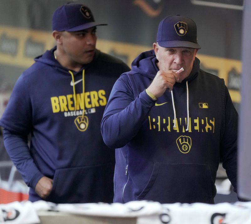 Milwaukee Brewers manager Pat Murphy (49) takes whiff of smelling salts during the first inning of their game against the San Diego Padres Thursday, May 14, 2026 at American Family Field in Milwaukee, Wisconsin.