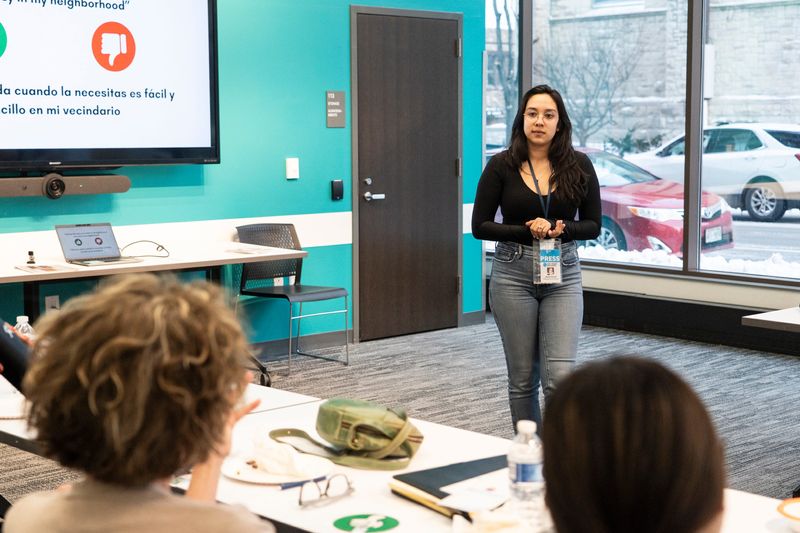 Alyssa N. Salcedo, the Layton Boulevard West reporter on the Neighborhood Dispatch at the Milwaukee Journal Sentinel, leads a listening session at the Mitchell Street Branch Library in Milwaukee, Wisconsin.