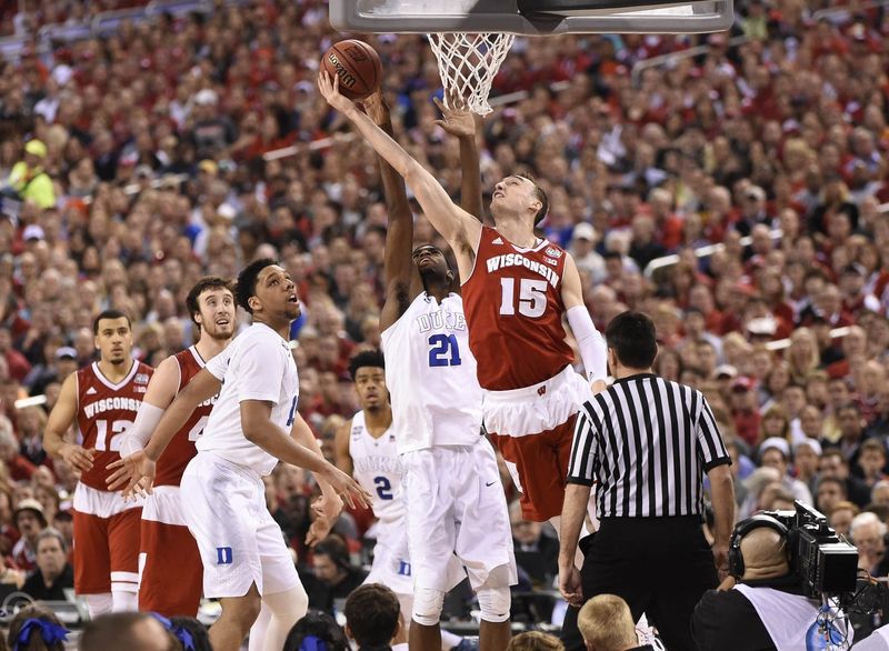 Apr 6, 2015; Indianapolis, IN, USA; Wisconsin Badgers forward Sam Dekker (15) lays the ball up past Duke Blue Devils forward Amile Jefferson (21) during the first half in the 2015 NCAA Men's Division I Championship game at Lucas Oil Stadium. Mandatory Credit: Robert Deutsch-USA TODAY Sports