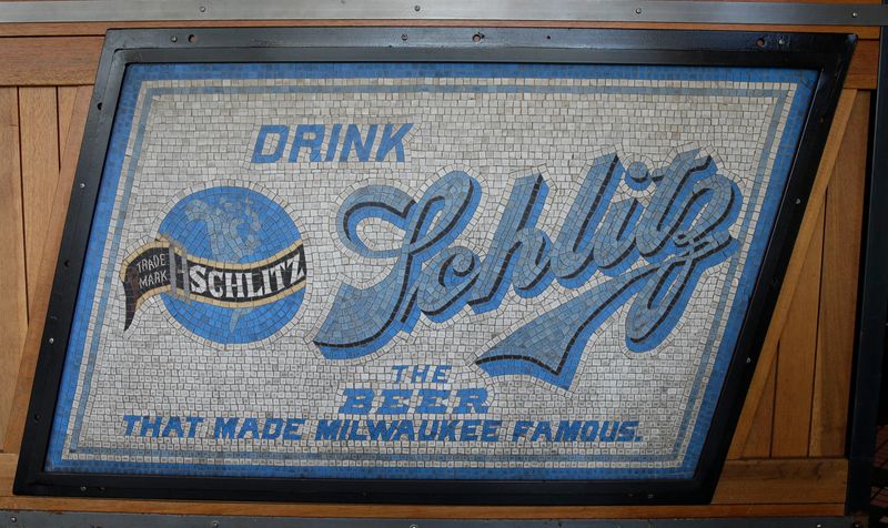 An early ceramic mosaic of Schlitz is featured at the entrance to Water Street Brewery where owner R.C. Schmidt has been collecting beer memorabilia since 1987. The items are displayed throughout the bar.