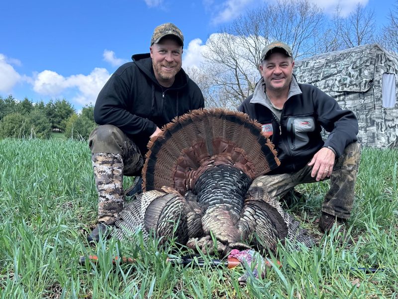 Ryan Fell of New Berlin, left, and Jim Smukowski of Oconomowoc pose with a wild turkey Smukowski called and Fell shot in Richland County during the 2026 Wisconsin spring turkey hunting season.