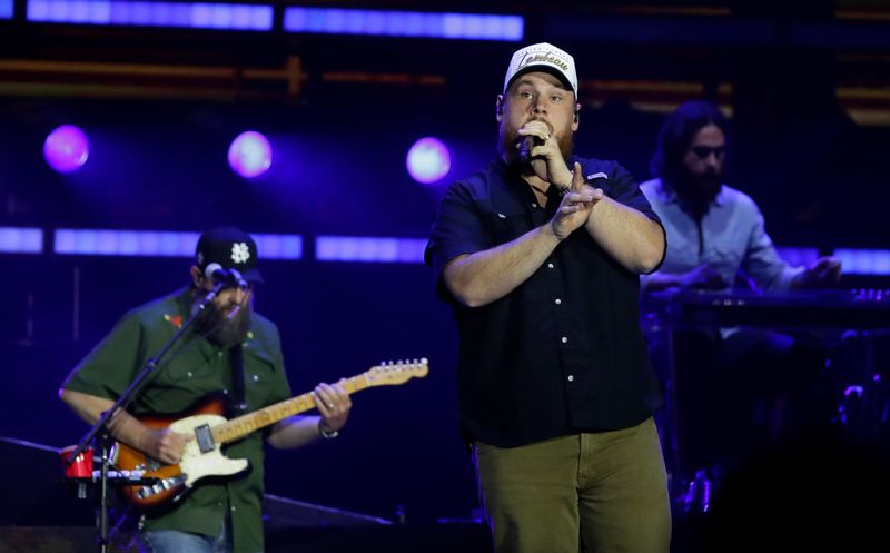 Country musician Luke Combs, wearing a Lambeau cap, performs May 15 during the first night of his My Kinda Saturday Night Tour at Lambeau Field in Green Bay. He'll be back May 16 for the second night.