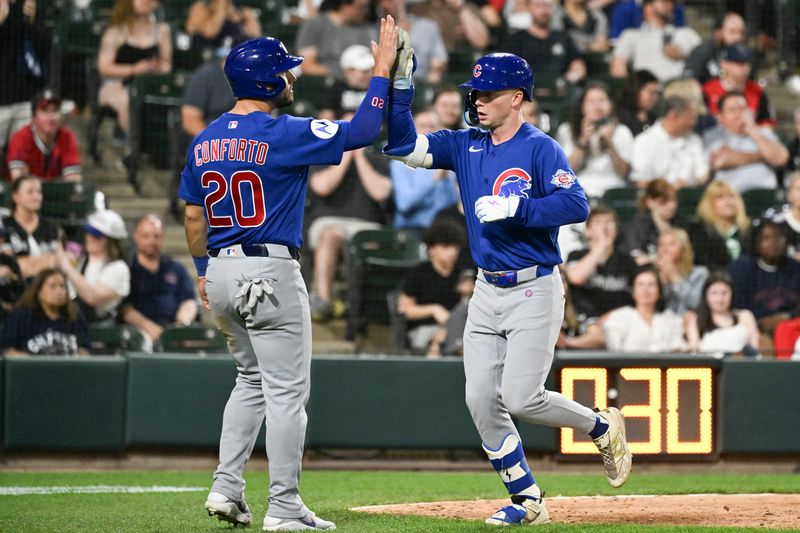 May 16, 2026; Chicago, Illinois, USA; Chicago Cubs center fielder Pete Crow-Armstrong (4) high fives right fielder Michael Conforto (20) after they score on his two-run home run against the Chicago White Sox during the ninth inning at Rate Field. Mandatory Credit: Matt Marton-Imagn Images