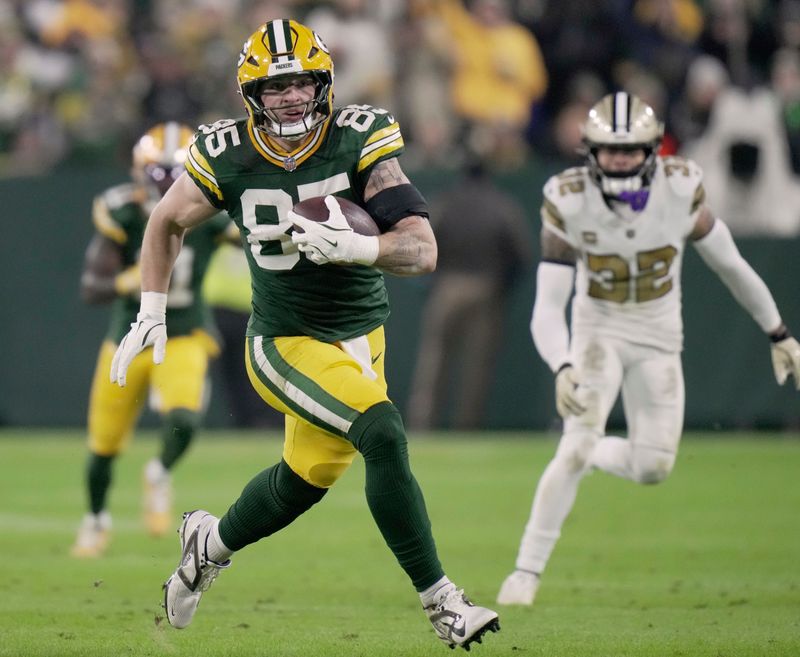 Green Bay Packers tight end Tucker Kraft (85) makes a reception for a first down during the second quarter of their game against the New Orleans Saints Monday, December 23, 2024 at Lambeau Field in Green Bay, Wisconsin.