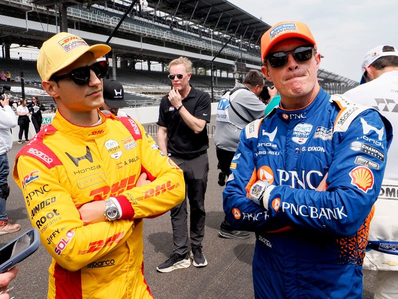 Chip Ganassi Racing teammates Alex Palou, left, and Scott Dixon talk ahead of a practice session for the 110th running of the Indianapolis 500. Palou is the defending winner and Dixon won in 2018.