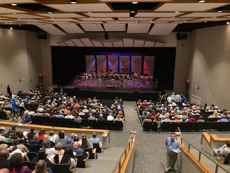 Audience members await the beginning of a spring concert by Watertown High School's concert band and wind symphony May 18, 2026. The playlist had originally included "A Mother of a Revolution," but the piece was banned by the School Board.