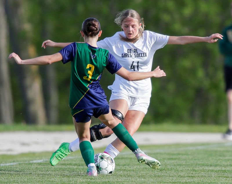Sheboygan Lutheran/Christian’s Elenore Faucher (3) and Ozaukee/Random Lake’s Lexi Gruman (41) battle for the ball at Sheboygan Christian, Tuesday, May 19,, 2026, in Sheboygan, Wis.