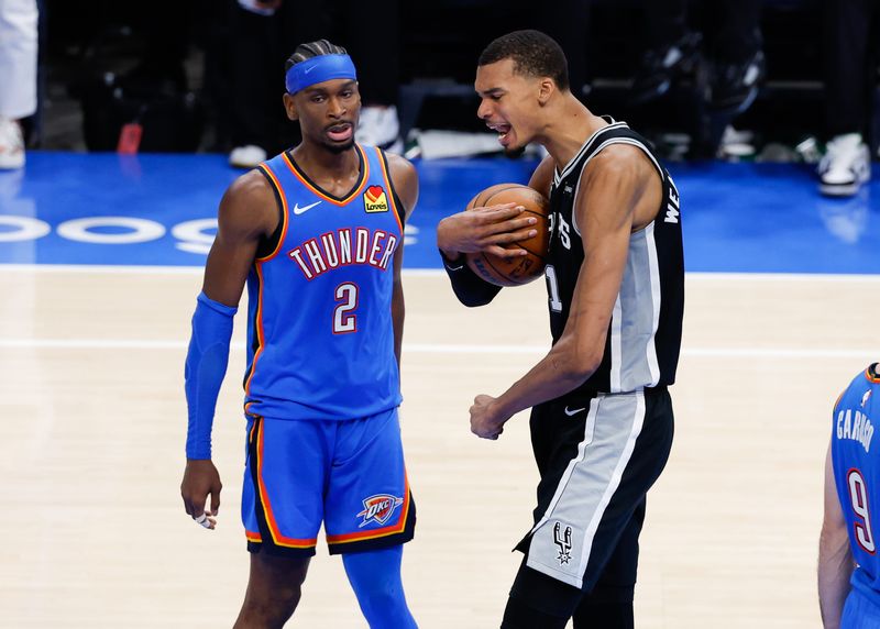 Spurs center Victor Wembanyama, right, reacts in double overtime against the Thunder during Game 1 of the Western Conference finals at Paycom Center in Oklahoma City on May 18, 2026.