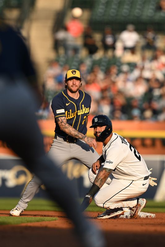 Brewers second baseman Brice Turang (2) and Detroit's Gleyber Torres look back to first base to watch the completion of a successful double play on April 22.  The Brewers rate Turang as an elite defender.