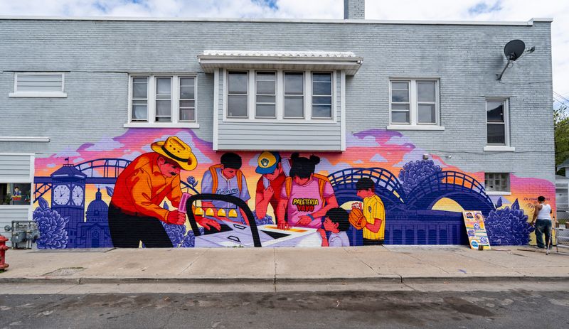 A mural titled “South Side en la Hora Magica,” created by artists Aisha Valentín and Whitney Salgado in partnership with Katie Avila Loughmiller of Luna Creative Collaborations, is displayed on the building of Paleteria Yayo, 1727 W Lincoln Ave., as the Milwaukee Brewers debut their first community mural of the year on May 20, 2026, in Milwaukee, Wisconsin.