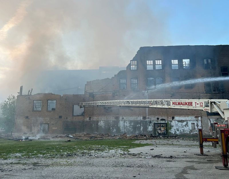 Work is done to extinguish a 5-alarm fire at a warehouse near West Hampton Avenue and North 32nd Street Milwaukee on Wednesday May 20, 2026.