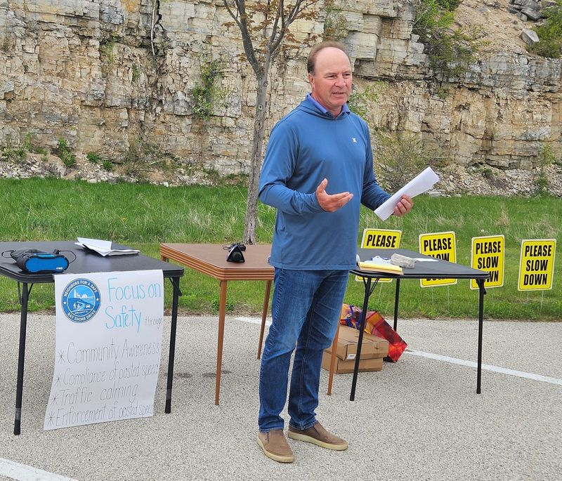 Jay Walters, a resident on Bay Shore Drive/County B and co-founder of the grassroots group Neighbors for a Safe Bay Shore Drive, speaks to the media and others in attendance during a May 19, 2026 presentation on the group's efforts to get drivers to obey speed limits on the scenic but heavily traveled road between Sturgeon Bay and the Town of Egg Harbor.