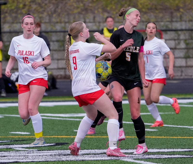 Pulaski High School's Anna Krause (9) and Green Bay Preble High School's Samantha Thompson (5) collide as they fight for possession on Thursday, May 21, 2026, at Green Bay Preble High School in Green Bay, Wis. The match ended in a 0-0 draw.
Tork Mason/USA TODAY NETWORK-Wisconsin
