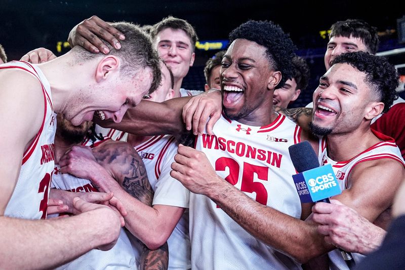 Wisconsin forward Aleksas Bieliauskas (32), left, and guard John Blackwell (25) celebrate 91-88 win over Michigan at Crisler Center in Ann Arbor on Saturday, Jan. 10, 2026.