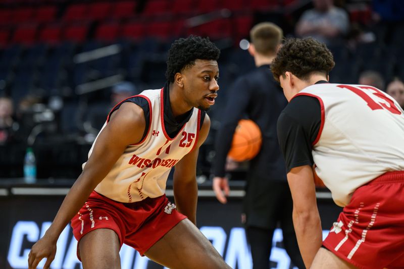 Mar 18, 2026; Portland, OR, USA; Wisconsin Badgers guard John Blackwell (25) defends against guard Hayden Jones (13) during a practice session ahead of the first round of the men's 2026 NCAA Tournament at Moda Center. Mandatory Credit: Craig Strobeck-Imagn Images