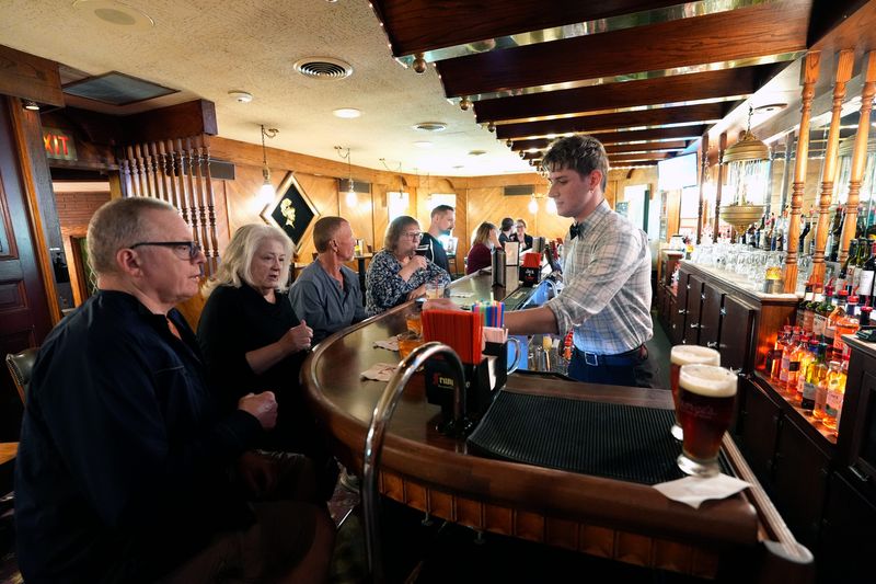 Tyson Secor serves drinks to customers at George's Steak House located at 2208 S. Memorial Drive Friday, May 22, 2026, in Appleton, Wisconsin.
