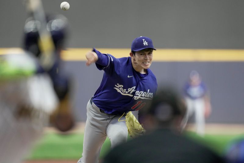 Los Angeles Dodgers pitcher Roki Sasaki (11) throws during the first inning of their game against the Milwaukee Brewers Saturday, May 23, 2026 at American Family Field in Milwaukee, Wisconsin.