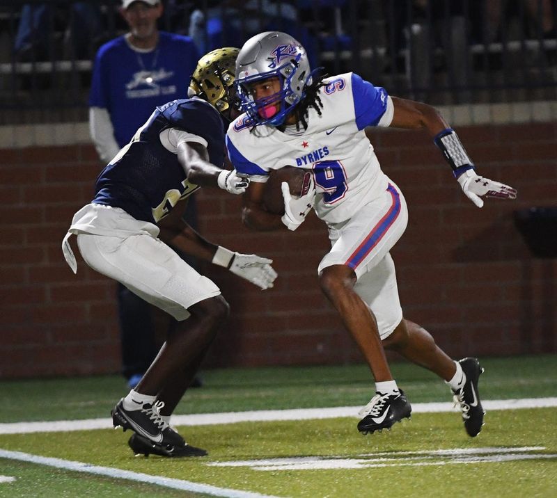 Byrnes played Spartanburg in high school football at Byrnes High School on Oct. 26, 2024. Spartanburg won the game 58-14. Byrnes' Chanin Harris (9) pulls down a ball and breaks down the field to the end zone.