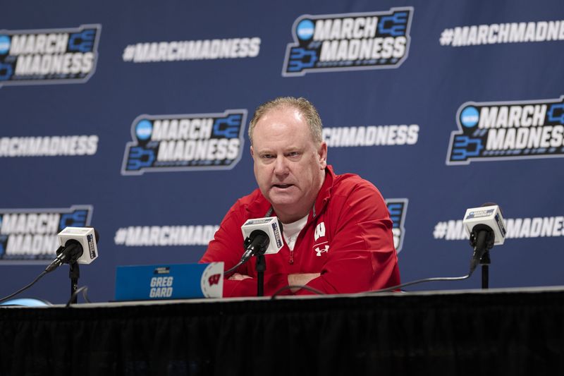 Mar 18, 2026; Portland, OR, USA; Wisconsin Badgers head coach Greg Gard answers questions during a press conference before a practice session ahead of the first round of the men's 2026 NCAA Tournament at Moda Center. Mandatory Credit: Troy Wayrynen-Imagn Images