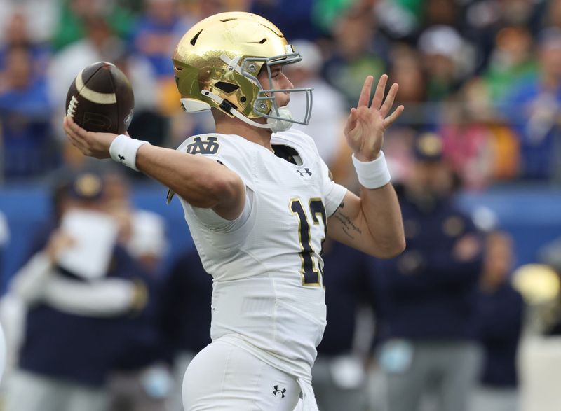 Nov 15, 2025; Pittsburgh, Pennsylvania, USA; Notre Dame Fighting Irish quarterback CJ Carr (13) passes against the Pittsburgh Panthers during the first quarter at Acrisure Stadium. Mandatory Credit: Charles LeClaire-Imagn Images